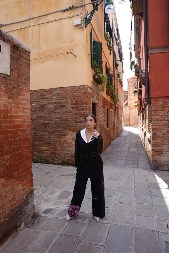 Black lace-style mesh blazer and pink starfish and hand-painted face pants