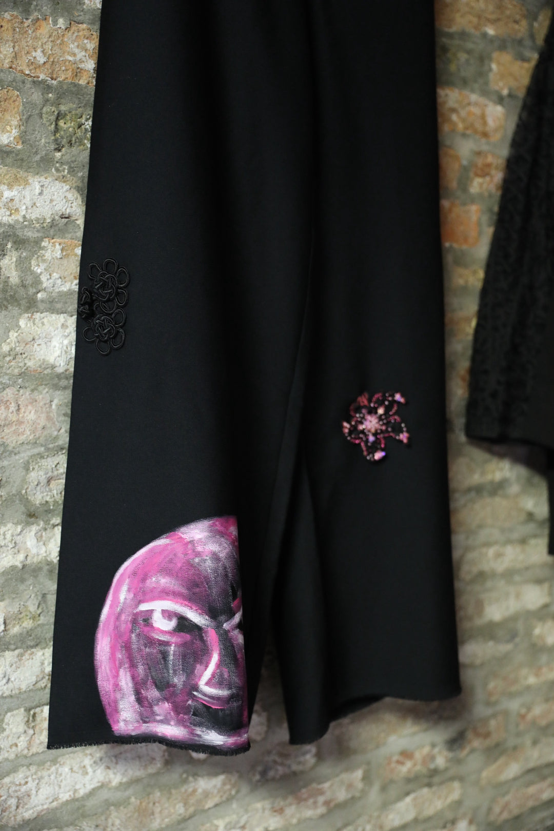 Black lace-style mesh blazer and pink starfish and hand-painted face pants